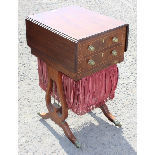 65 - A Victorian Mahogany dropleaf sewing table with boxwood stringing