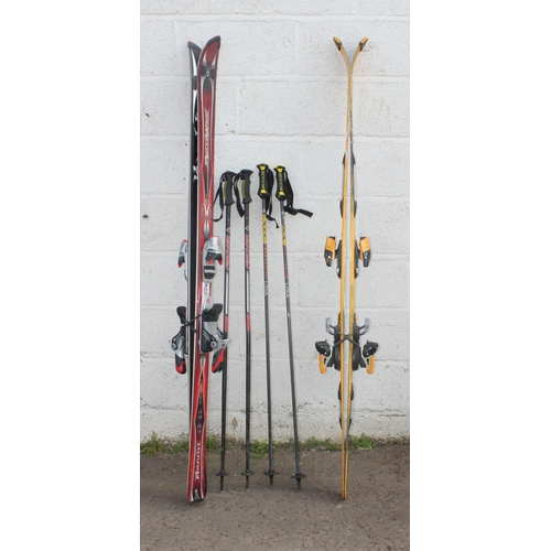 652 - 2 pairs of skis and poles