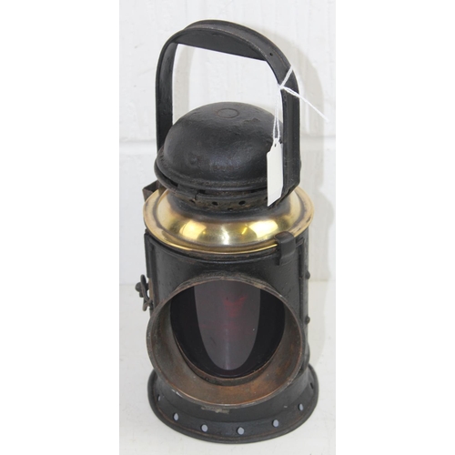 766 - A vintage brass and metal railway lamp with rotating lenses