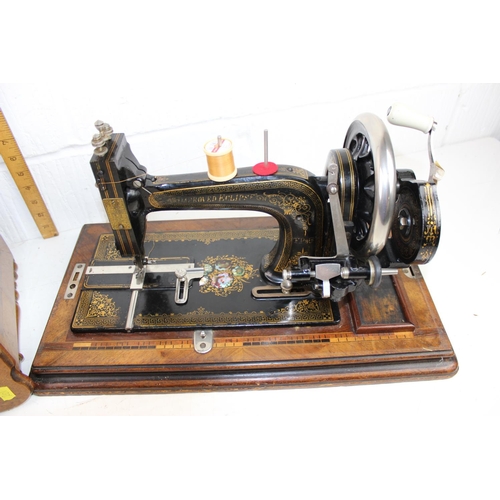 768 - Wooden cased Improved Eclipse sewing machine