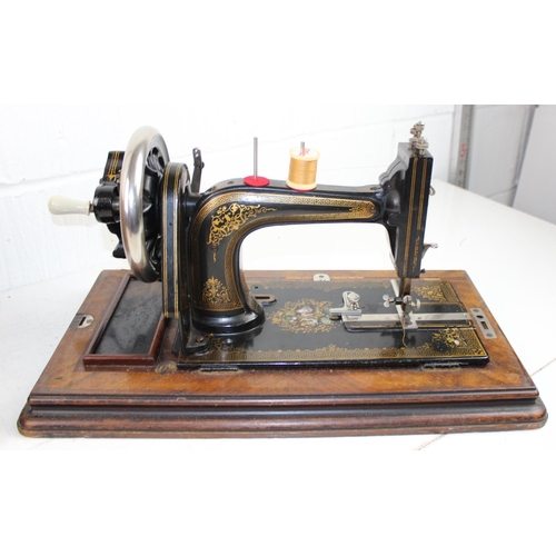 768 - Wooden cased Improved Eclipse sewing machine