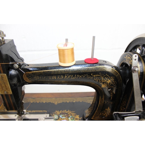 768 - Wooden cased Improved Eclipse sewing machine