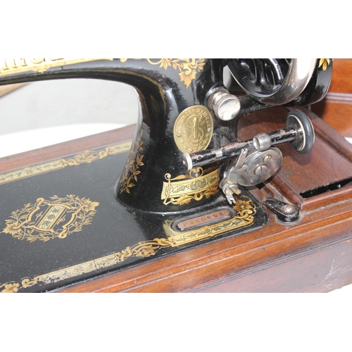 769 - Antique wooden cased Singer sewing machine