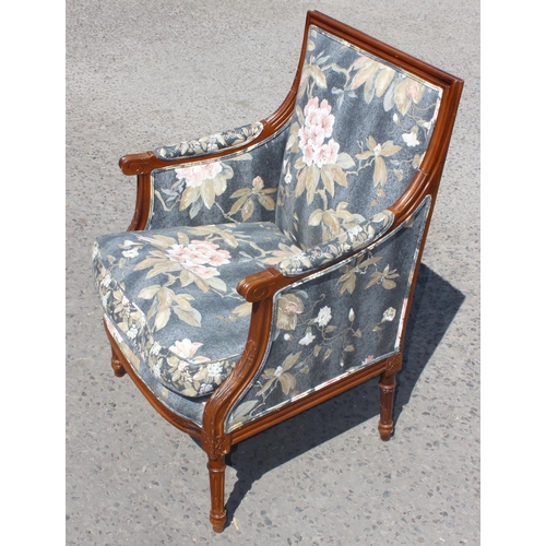 84 - A pair of French style armchairs with carved details