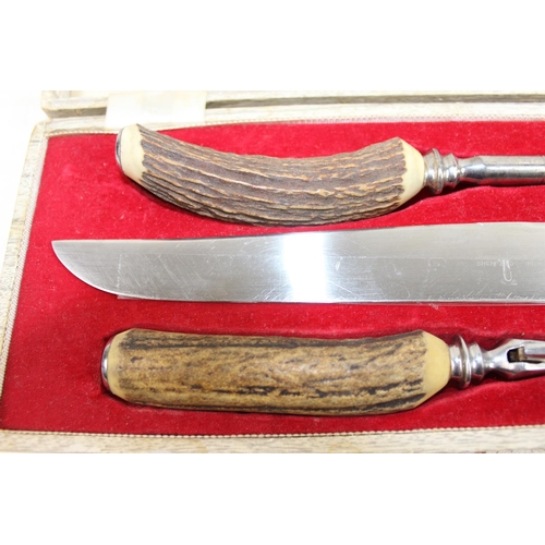 1036 - 3 piece Sheffield steel stag horn handled carving set in original lined presentation case.