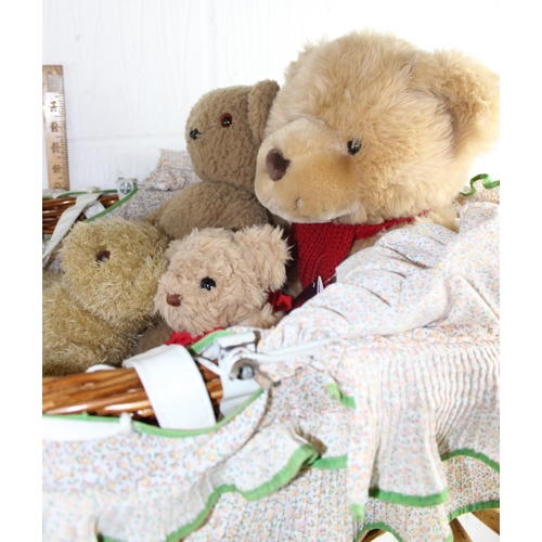 1467 - Vintage wicker cot on stand containing vintage teddy bears