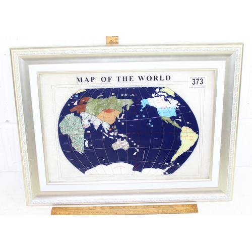 373 - Mother of pearl gemstone map of the world with inlaid semi-precious stones in silver coloured frame