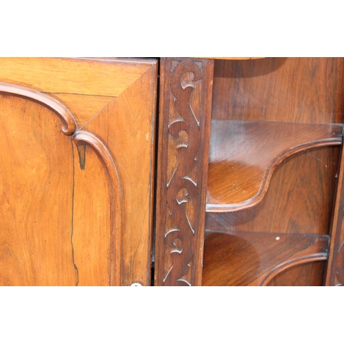 148 - A Victorian Rosewood Credenza cabinet with carved back and 2 symmetrical shelving units