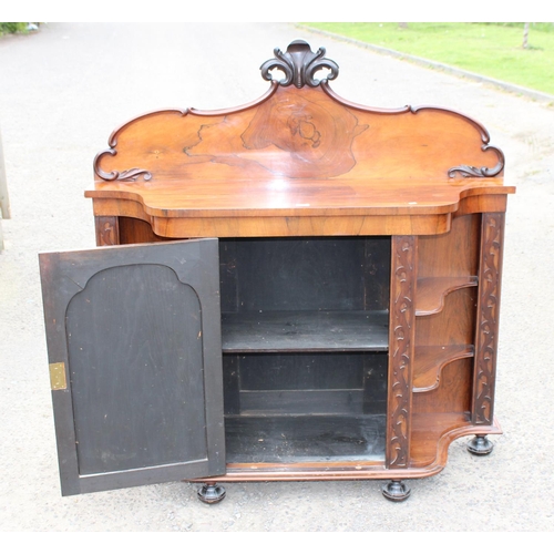 148 - A Victorian Rosewood Credenza cabinet with carved back and 2 symmetrical shelving units