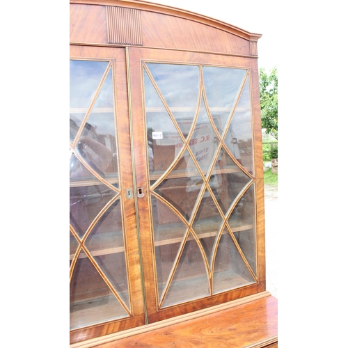 167 - A George III mahogany Secretaire bookcase, with astragal glazed doors above 5 drawers, the top 2 fit... 