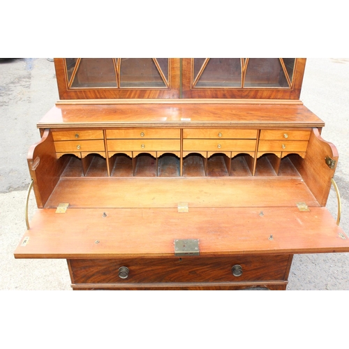 167 - A George III mahogany Secretaire bookcase, with astragal glazed doors above 5 drawers, the top 2 fit... 