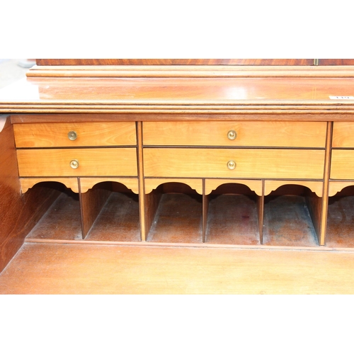 167 - A George III mahogany Secretaire bookcase, with astragal glazed doors above 5 drawers, the top 2 fit... 