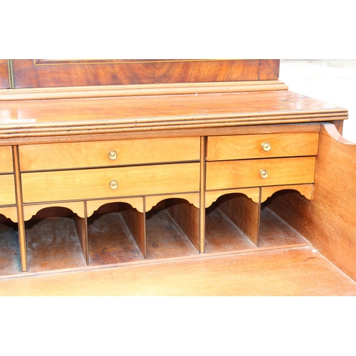 167 - A George III mahogany Secretaire bookcase, with astragal glazed doors above 5 drawers, the top 2 fit... 