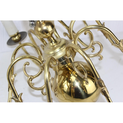 233A - A large pair of hanging brass chandeliers