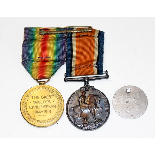 1038 - A pair of WW1 medals to 199640  GNR. G.A. BYWATER. Royal Artillery and a dog tag