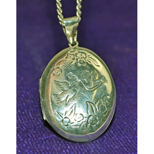 1232 - Hallmarked silver chain with large locket engraved with doves of peace