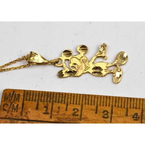 1243 - 9ct Gold chain with Mickey Mouse pendant - 3.5g