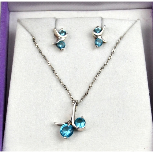 1290 - Silver and topaz necklace and earring set