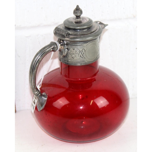 1647 - A 18th century silver plate and cranberry glass claret jug of ovoid form