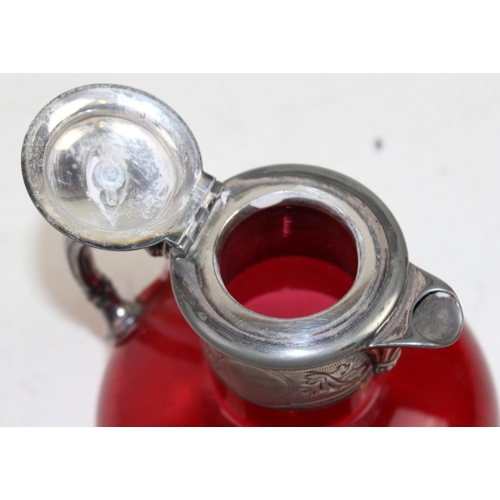 1647 - A 18th century silver plate and cranberry glass claret jug of ovoid form