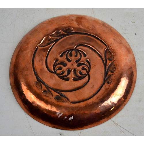 1670 - An Art Nouveau copper dish with embossed decoration in the style of Keswick