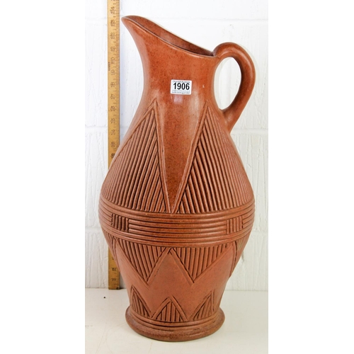 1906 - A large ethnic style earthenware ewer with geometric decoration