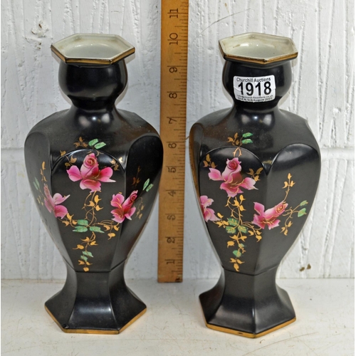 1918 - A pair of antique black ground vases decorated with roses, marked Deal