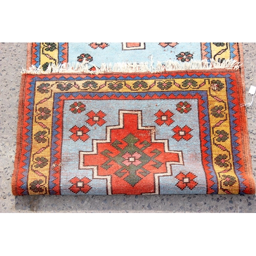 202 - A vintage red and blue ground runner rug