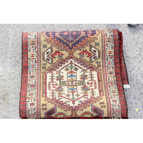 210 - A long Iranian multi-coloured runner rug