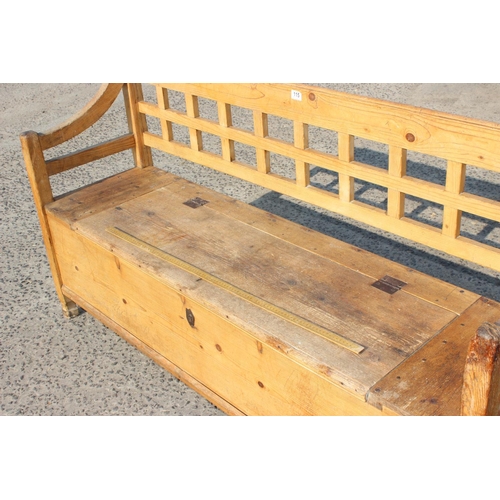 115 - A large pine settle or bench with storage box