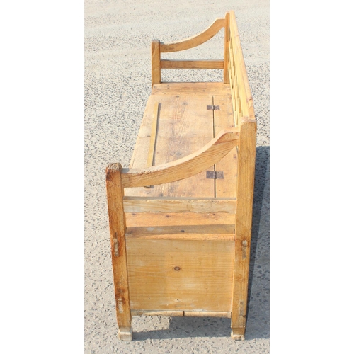 115 - A large pine settle or bench with storage box