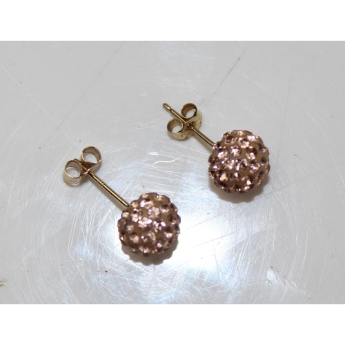 1287 - Pair of 9ct gold earrings with light pink stones