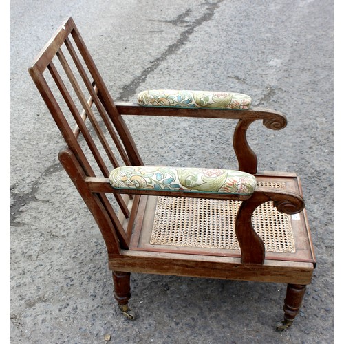 41 - Antique Bergere seated armchair with brass casters