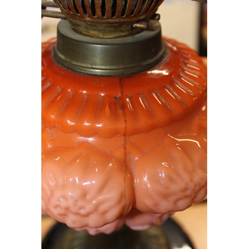 243 - An impressive antique oil lamps with graduated coral coloured reservoir, Eltex burner and etched gla... 