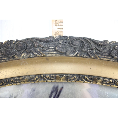 301 - Large antique oval gilt framed mirror