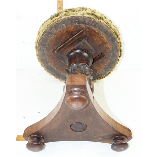 61 - Victorian screw top piano stool with carved pedestal and later upholstered top