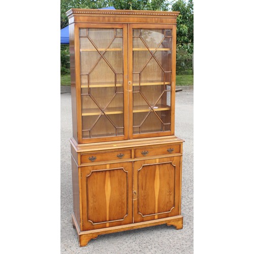 113 - A 20th century Yew wood veneered astral glazed display cabinet with cupboard base 1/4