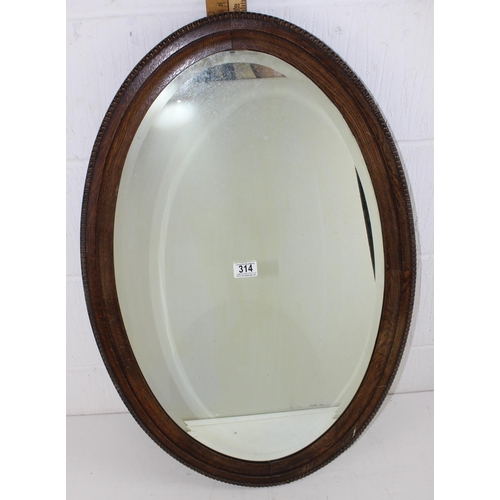 313 - Early 20th century oval framed mirror