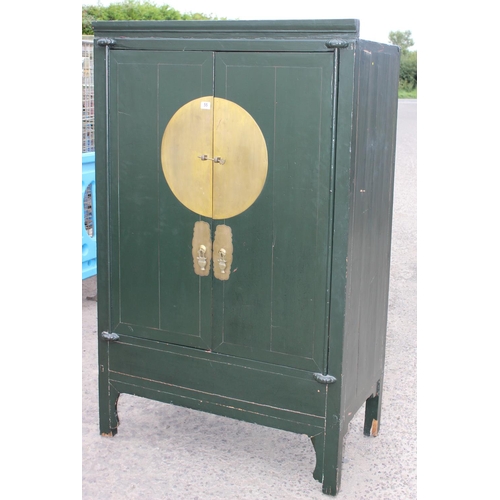 55 - A Chinese marriage cabinet with metal mounts, likely 19th or early 20th century, later green paintin... 