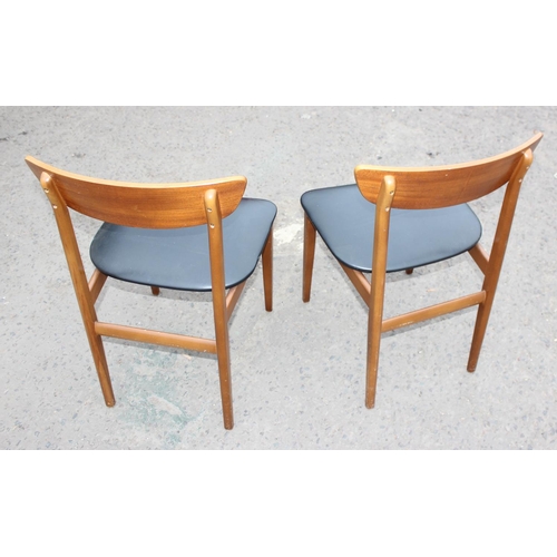 77 - Pair of retro dining chairs with black seats