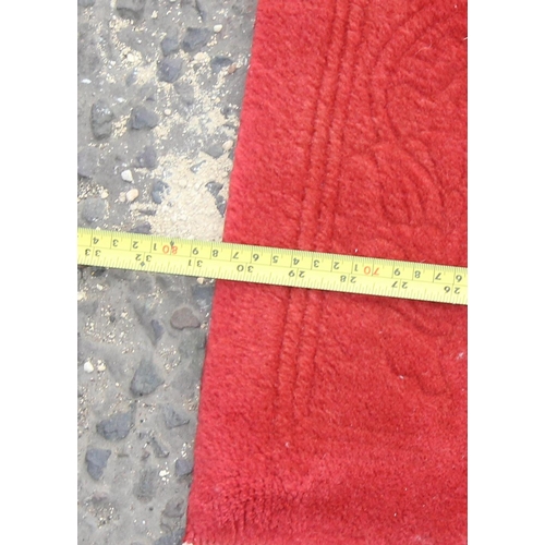 207 - A good quality red ground wool rug