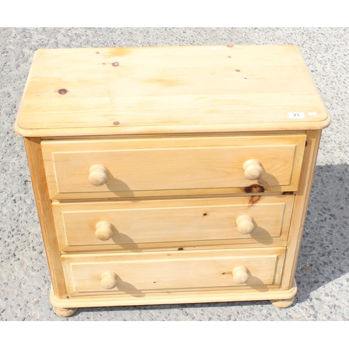 23 - A pine 3 drawer chest of drawers