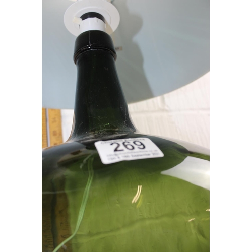 269 - A large green carboy style table lamp