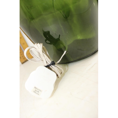 269 - A large green carboy style table lamp