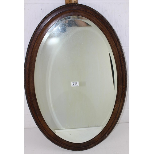 313 - Early 20th century oval framed mirror