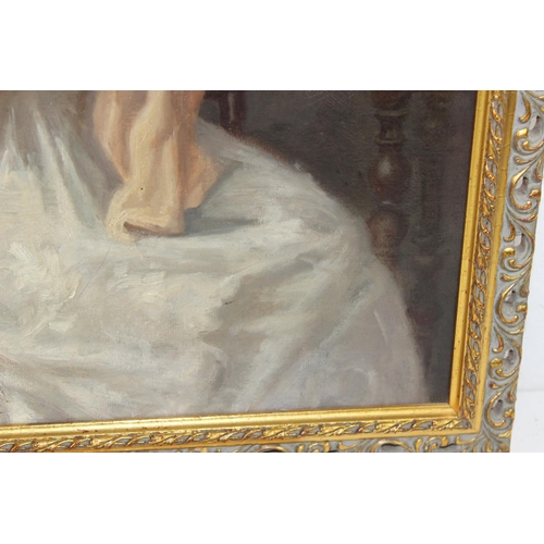 325 - A 20th century oil on board of a lady sewing in gilt frame - unsigned