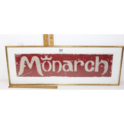 331 - A vintage painted metal Monarch advertising sign in later frame