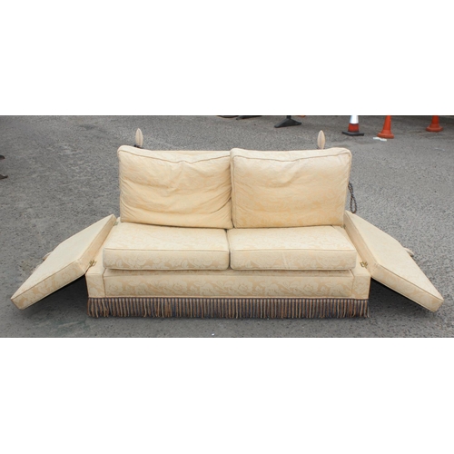 34 - A Victorian style Knole drop end sofa in light yellow fabric