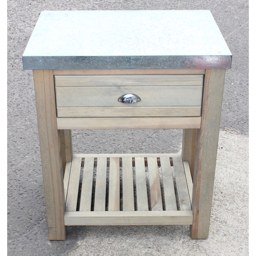 35 - A wooden butcher's type table with galvanised metal top 1/2