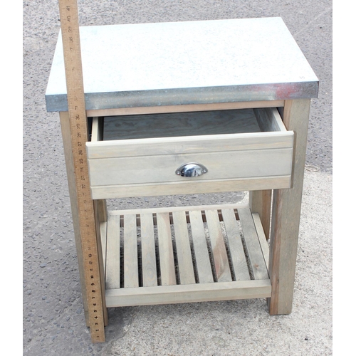 35 - A wooden butcher's type table with galvanised metal top 1/2